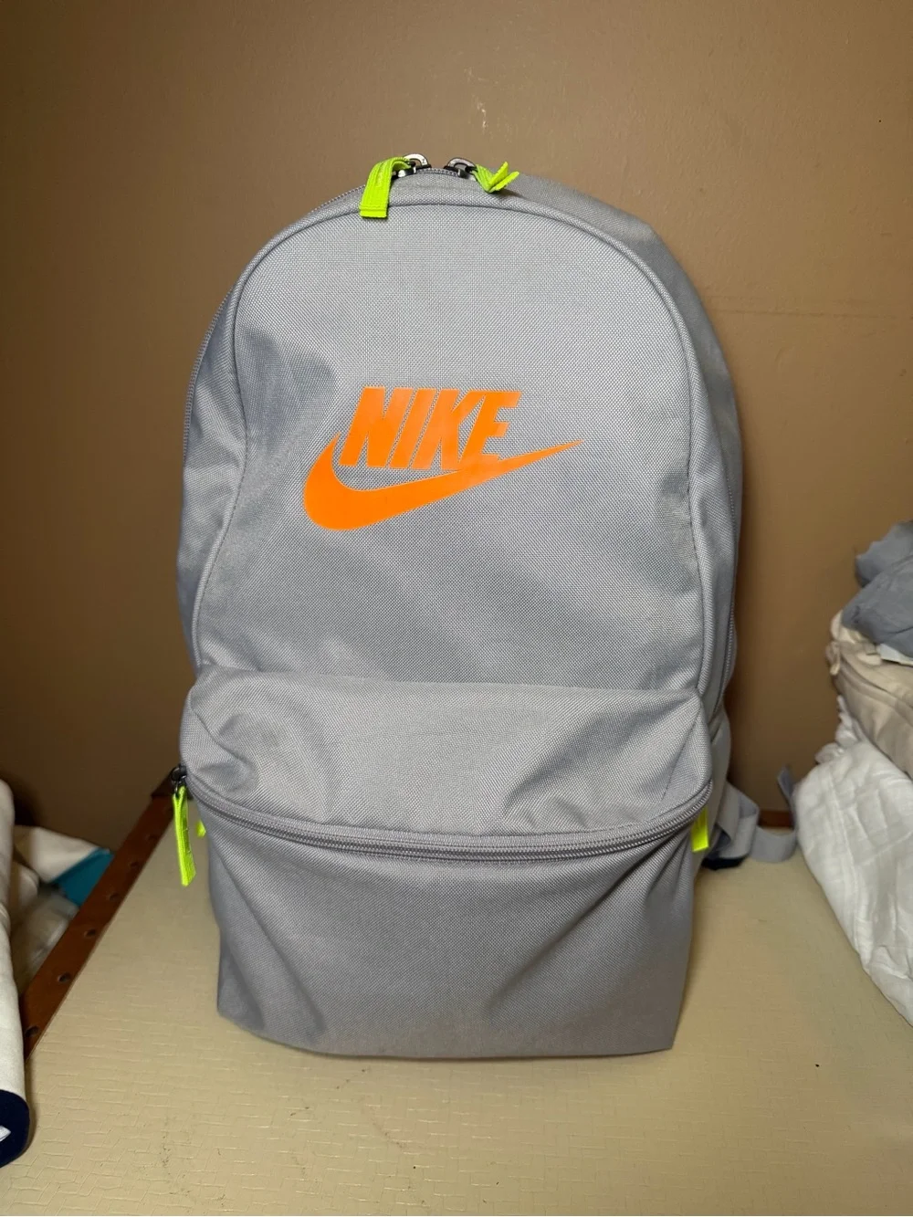 Nike Light Gray Backpack with Bright Orange Logo and Neon Accents